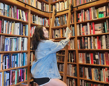 profile photo of Ada looking at books